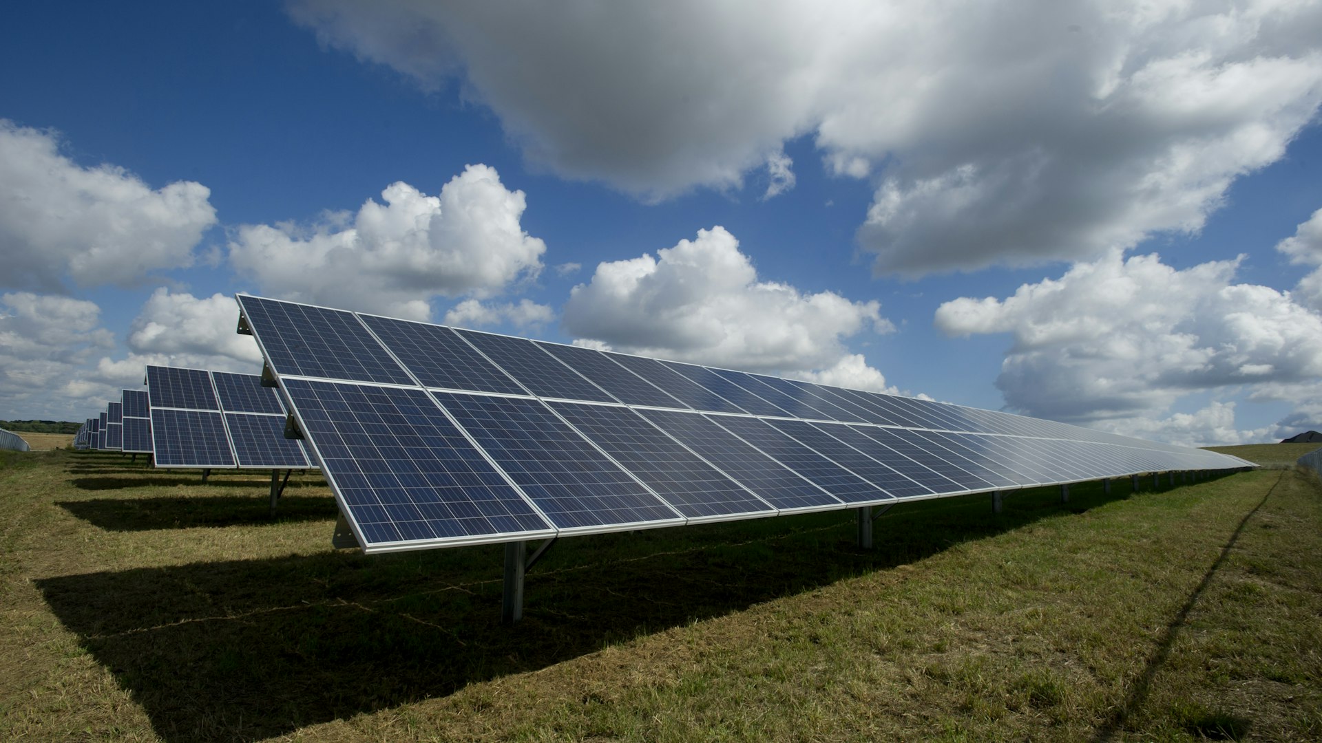 Solar panels facing the Guadarrama mountains at dawn